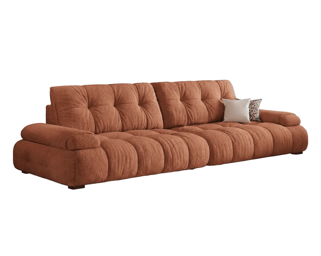 Brown sofa with tufted backrests on a white background