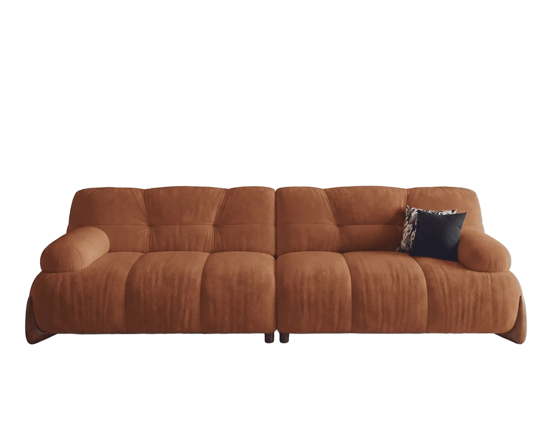 Brown sofa with a single pillow on a white background