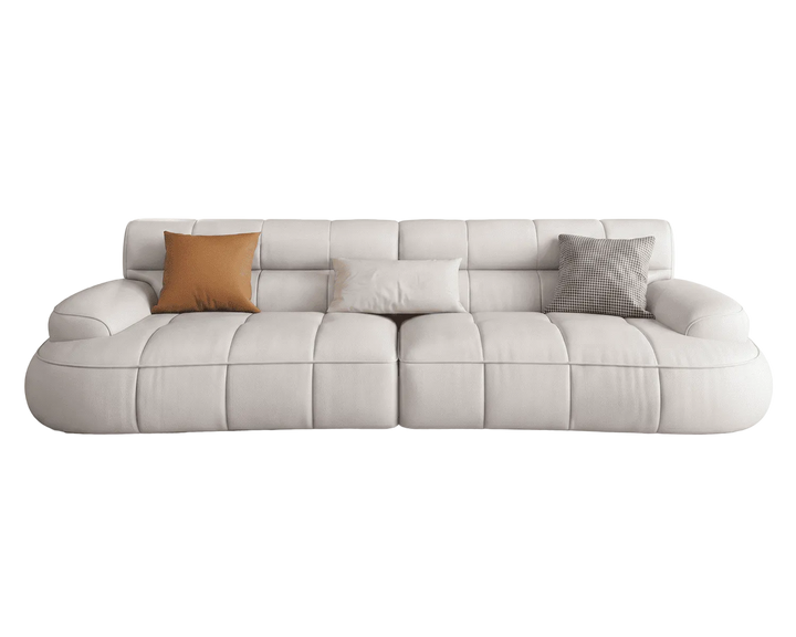 Gray sofa with three cushions on a white background